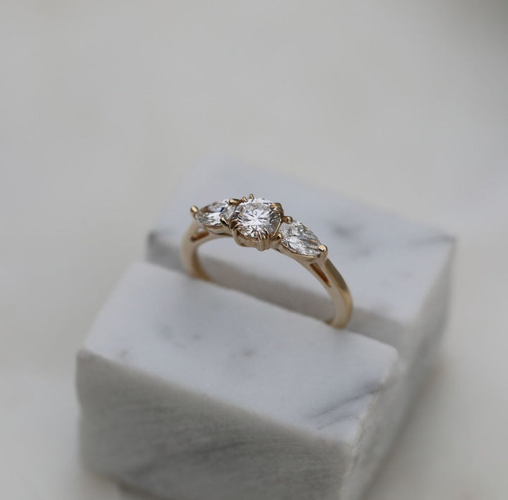 Round solitaire engagement ring viewed from the side