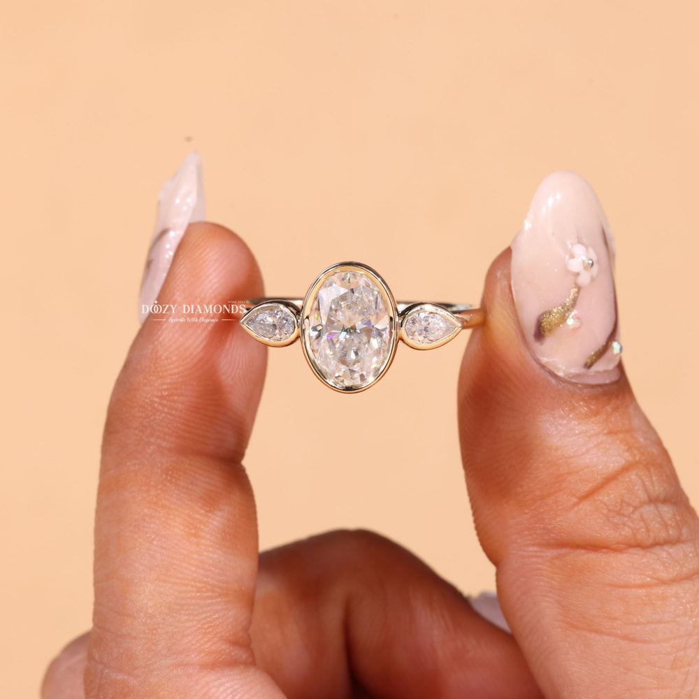 Lifestyle shot of oval bezel diamond ring on hand
