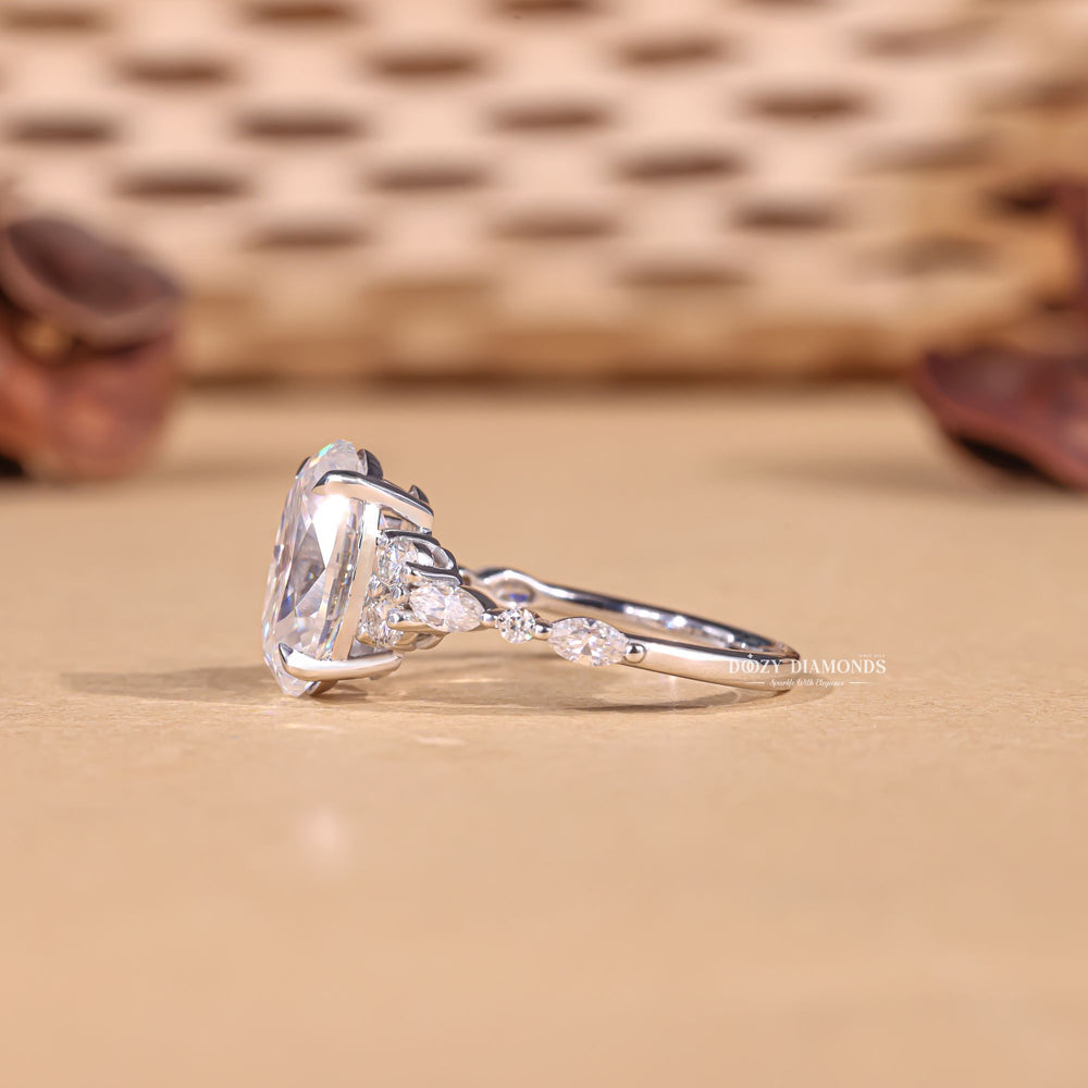 Detailed close-up of oval cluster diamond engagement ring