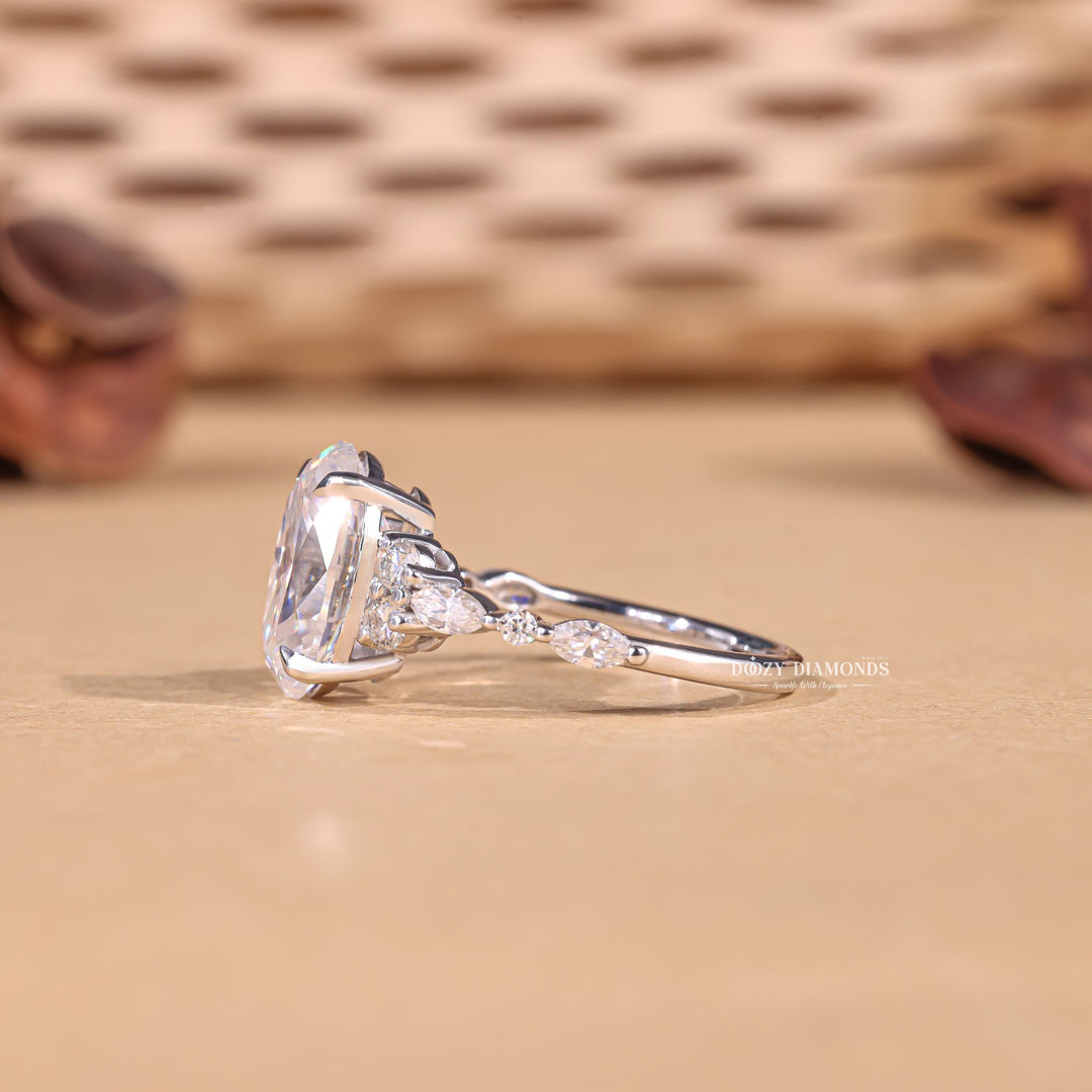 Detailed close-up of oval cluster diamond engagement ring