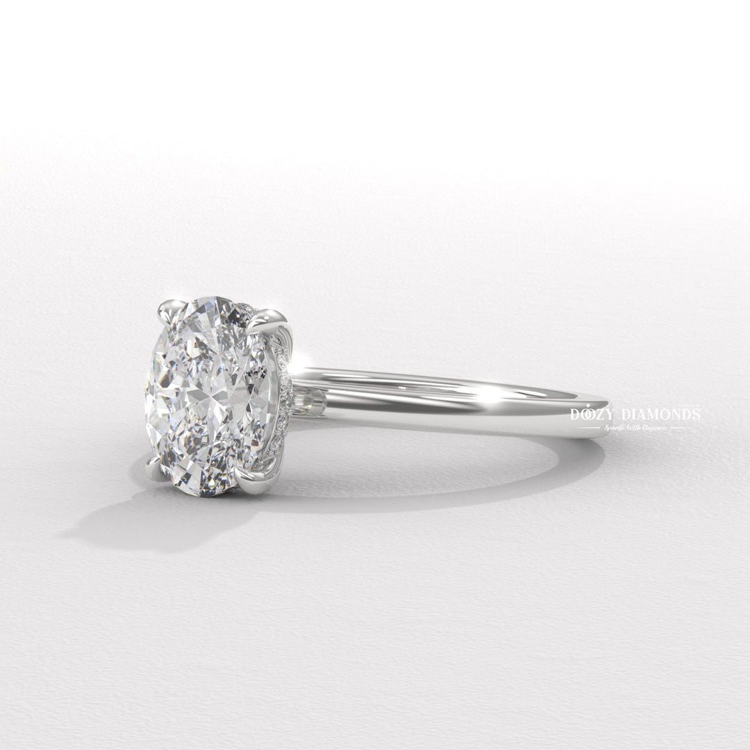 Oval solitaire engagement ring viewed from the side