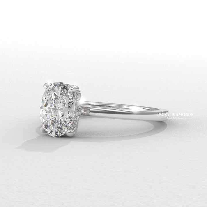 Oval solitaire engagement ring viewed from the side