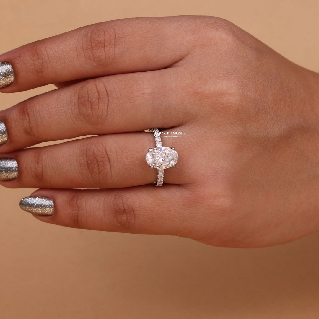 Close-up of oval cut center diamond in hidden halo engagement ring