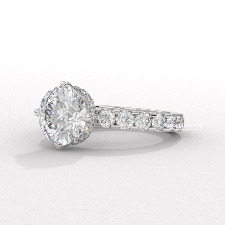Round cut hidden halo engagement ring shown in real-life wear