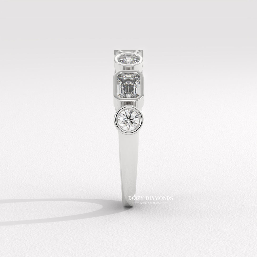 Side view of round & emerald diamond wedding band