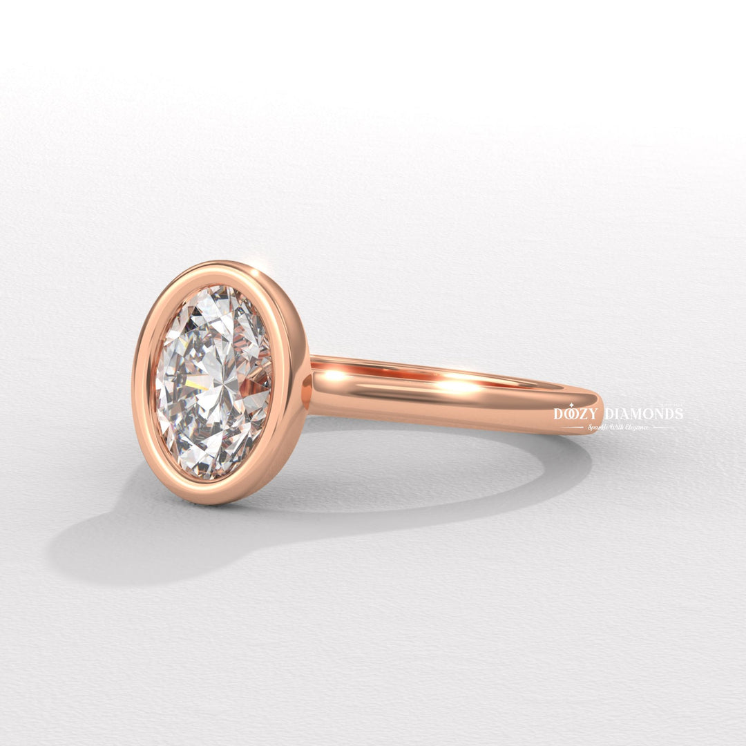 Oval cut diamond ring worn on hand
