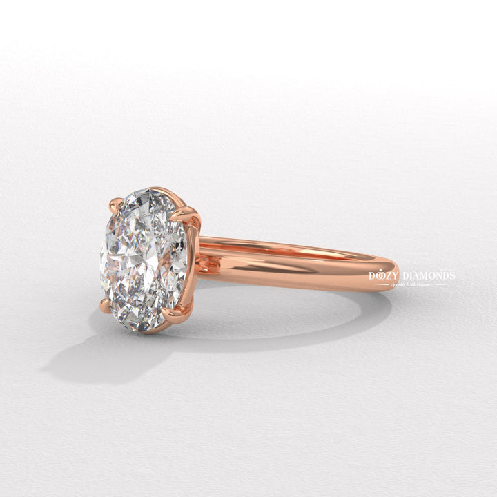 Oval solitaire diamond engagement ring available in multiple metals