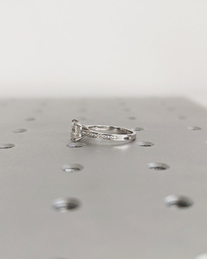 Asscher solitaire engagement ring photographed in natural light