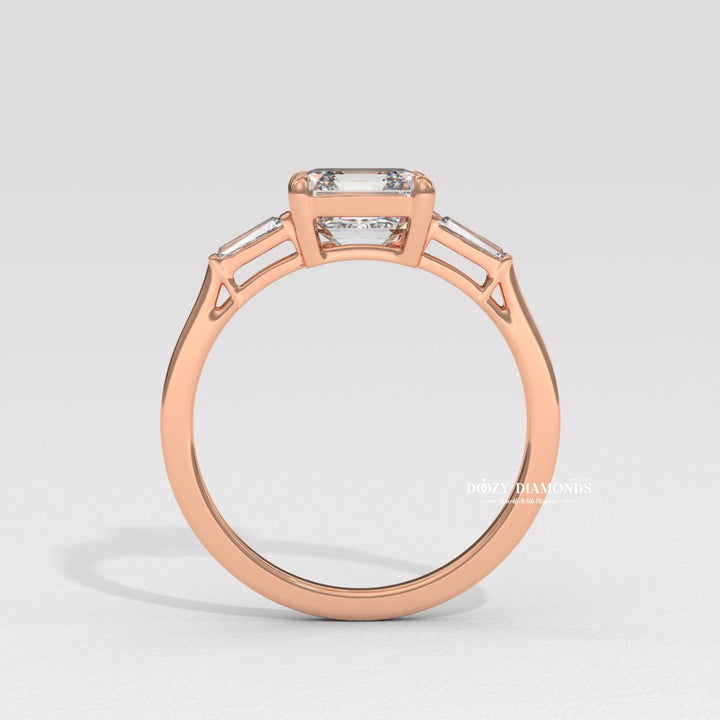 Asscher three stone lab grown diamond ring fitted on finger
