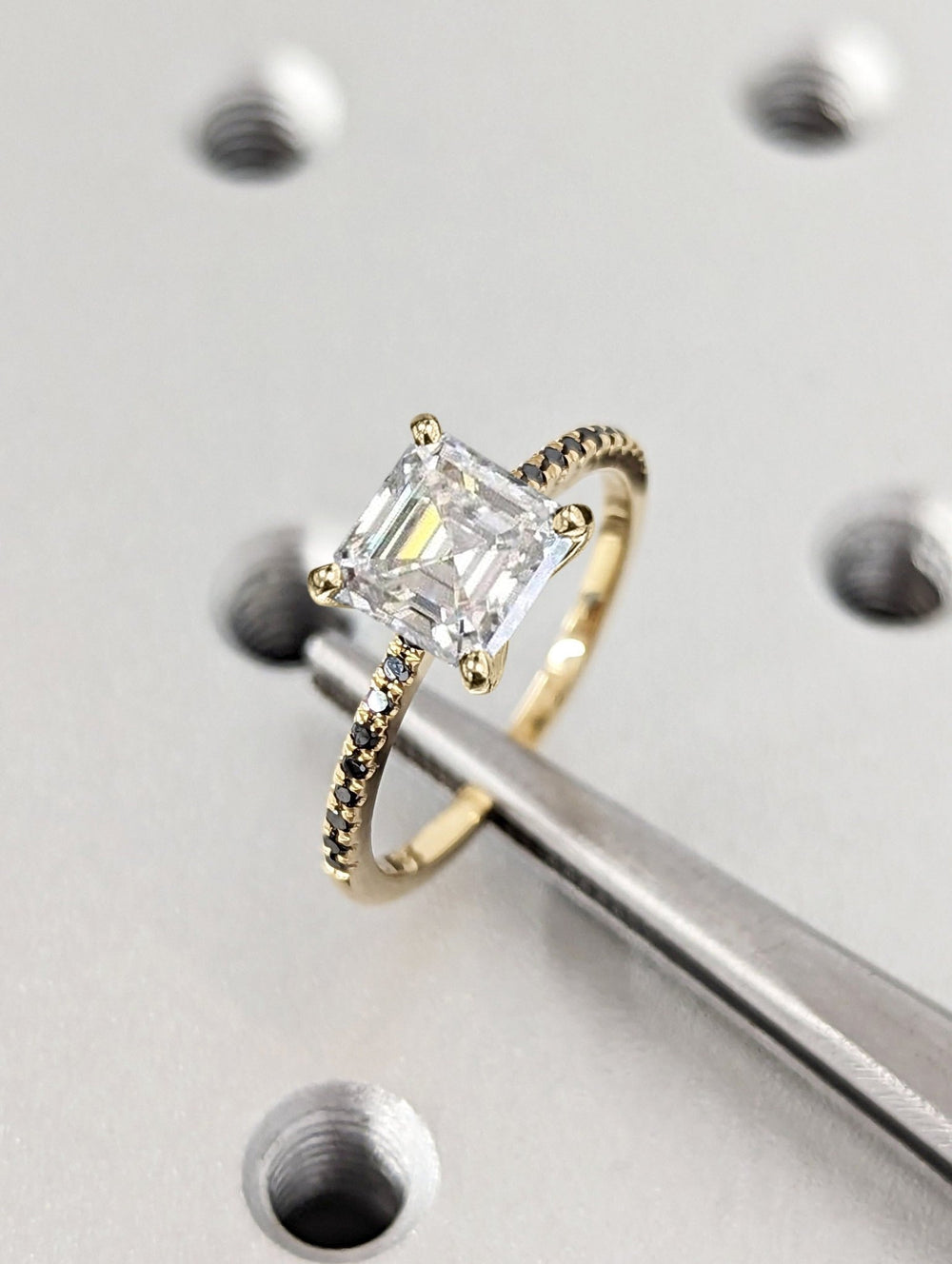 Profile view of asscher cut pave engagement ring band
