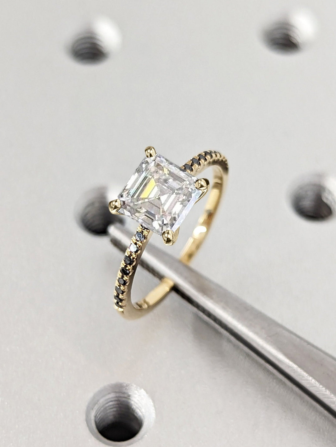 Profile view of asscher cut pave engagement ring band
