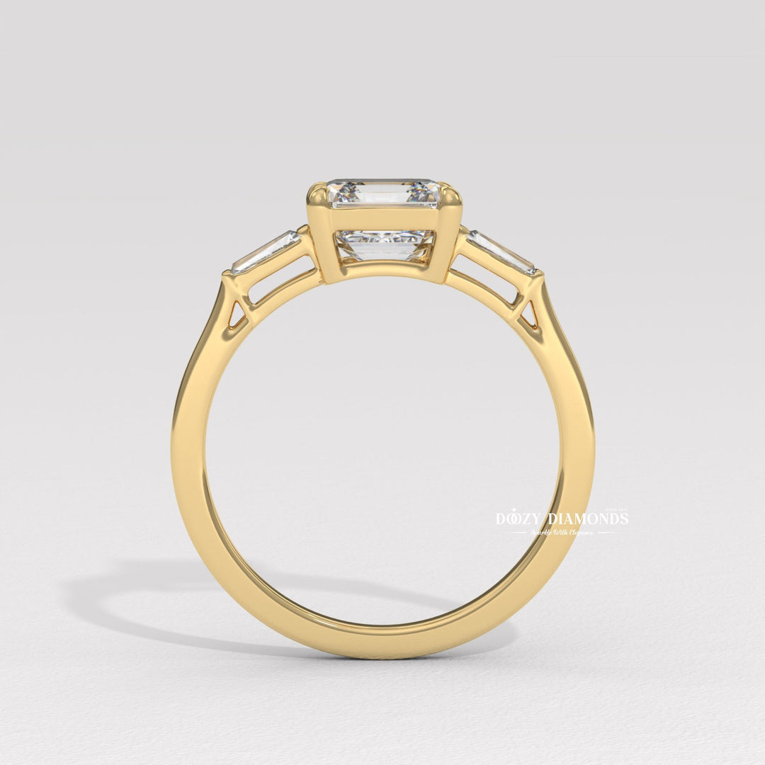 Detailed close-up of asscher three stone diamond engagement ring