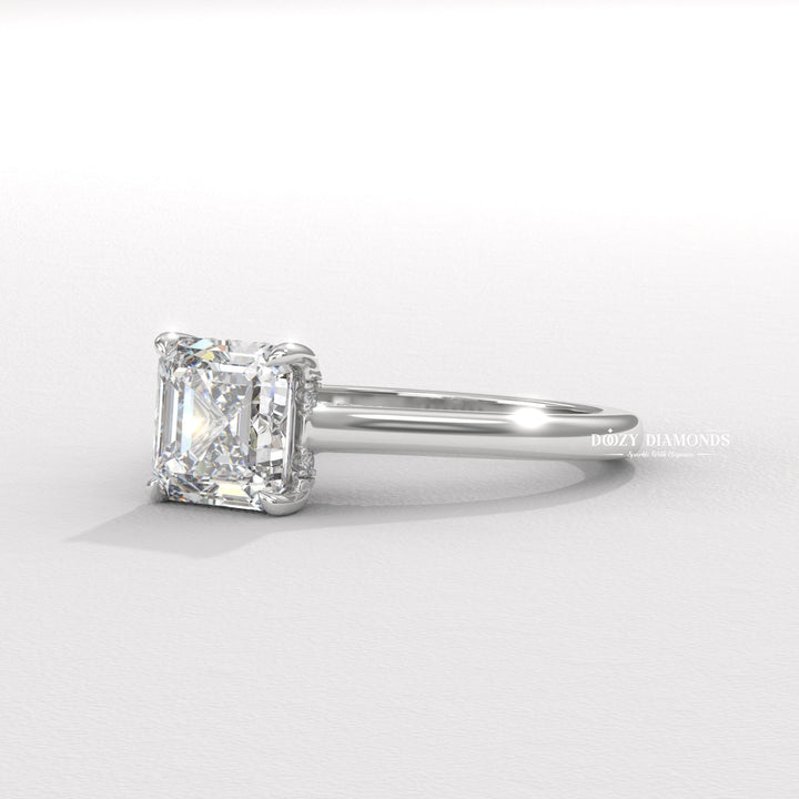 Angled view of asscher cut diamond in hidden halo setting