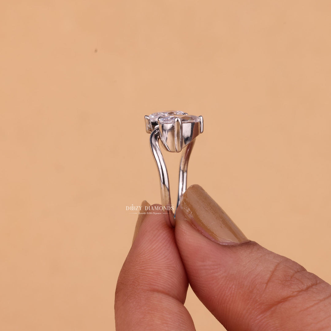 Pear solitaire engagement ring shown on hand for true-to-life sizing
