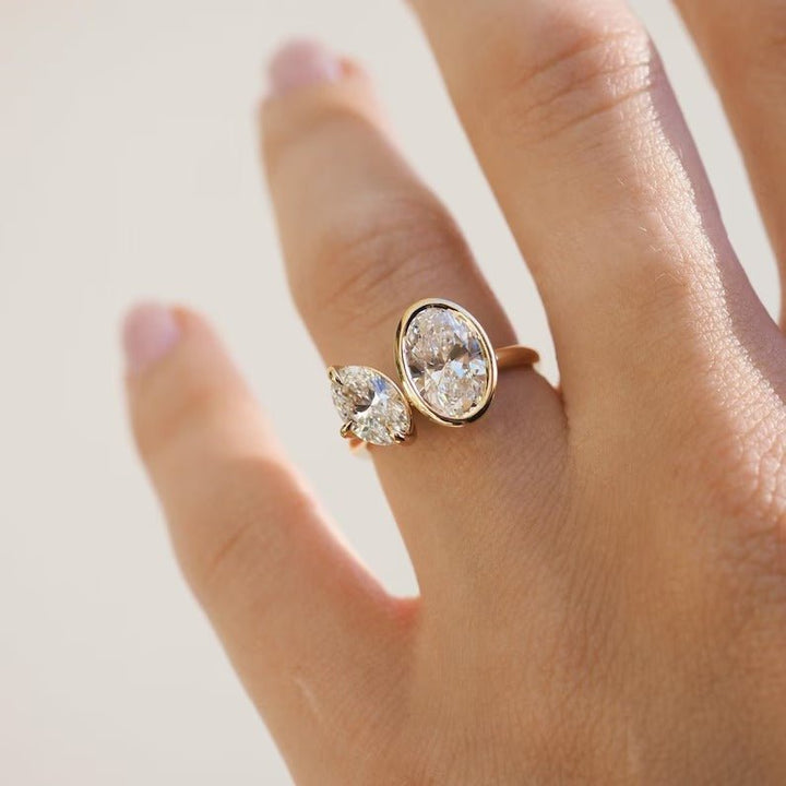Oval cut diamond ring worn on hand