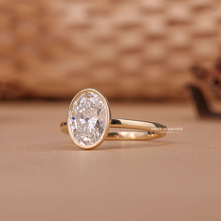 Oval bezel engagement ring with IGI certificate and packaging