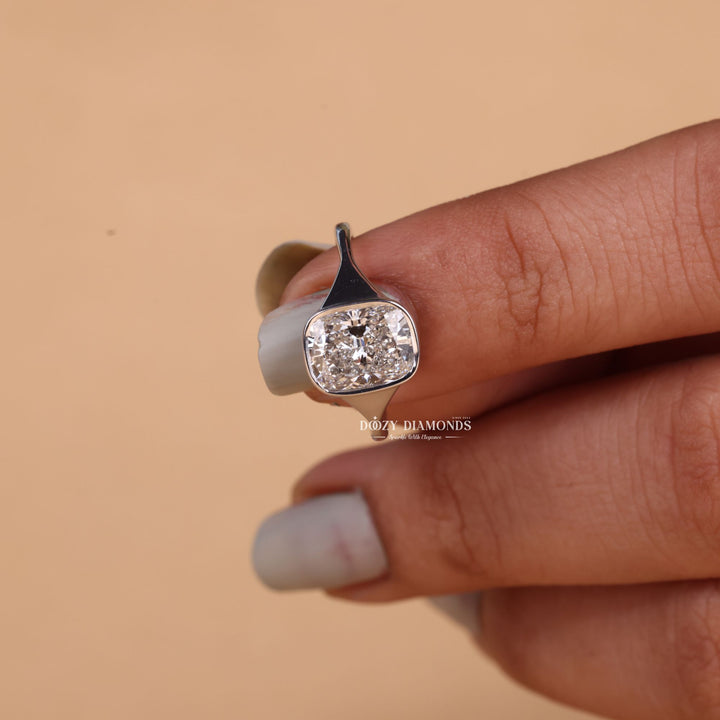 Cushion cut diamond ring worn on hand