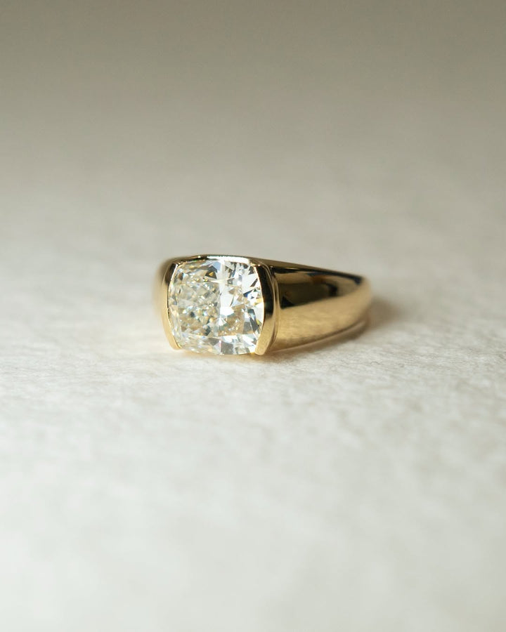 Cushion bezel engagement ring close-up showing high clarity diamond clarity
