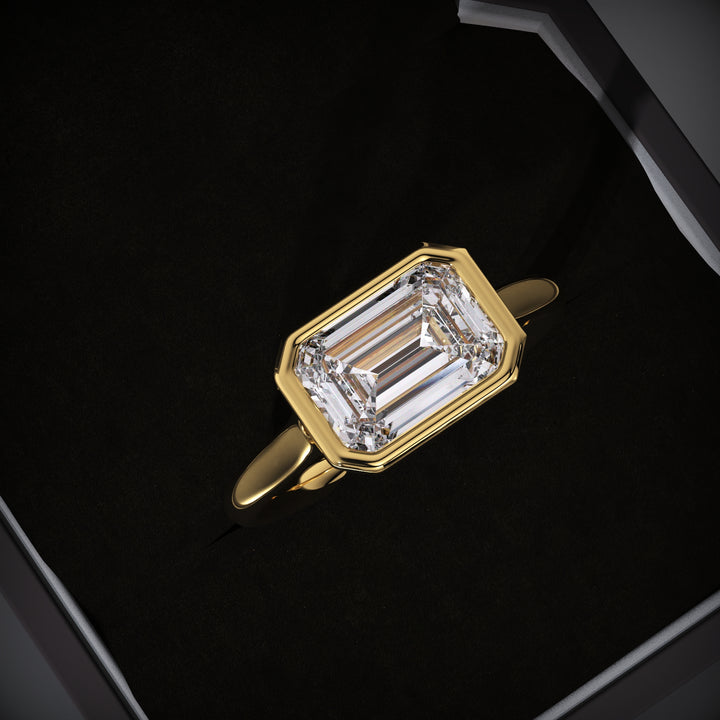 Emerald cut east west engagement ring available to buy now