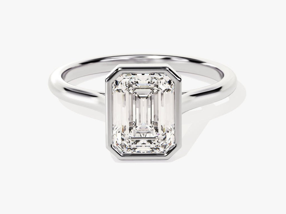Emerald bezel engagement ring close-up showing high clarity diamond clarity