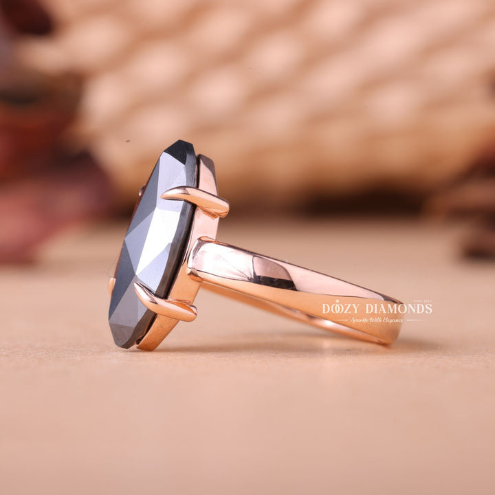 Detailed close-up of marquise solitaire diamond engagement ring