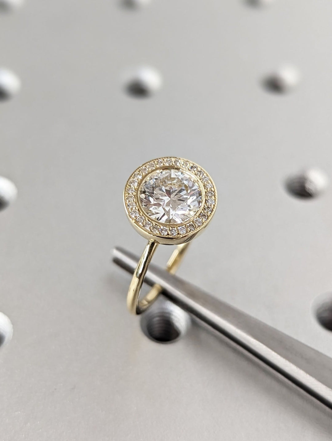 Fine craftsmanship detail on round solitaire engagement ring
