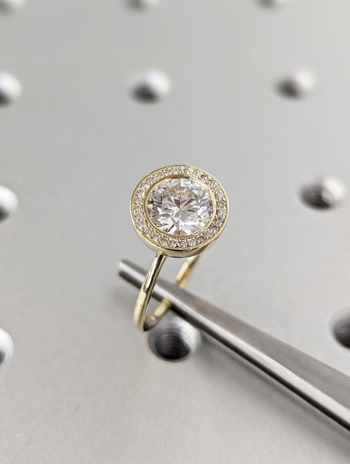 Fine craftsmanship detail on round solitaire engagement ring