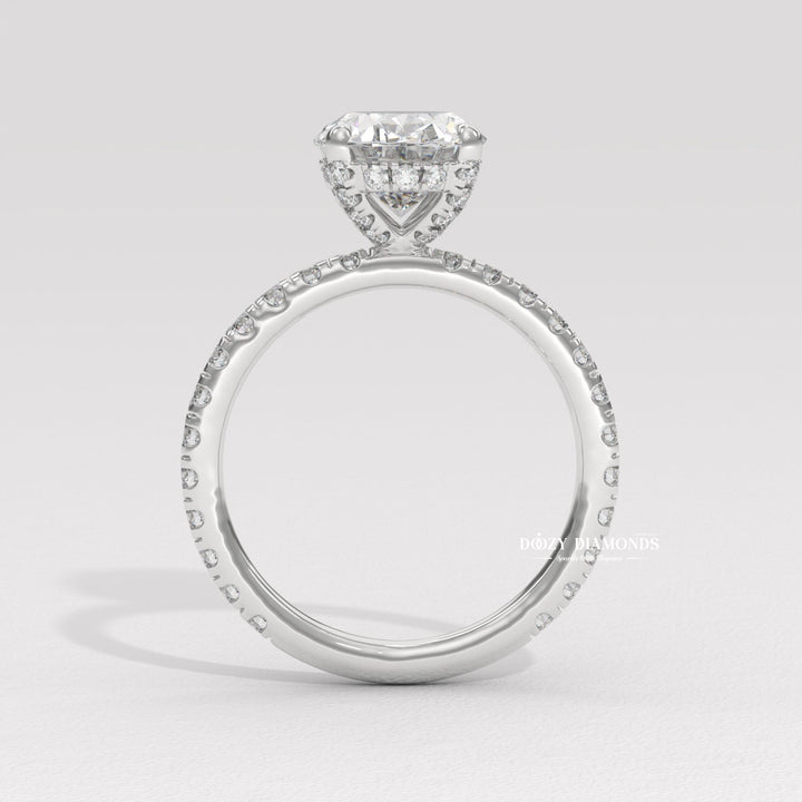 Profile view of oval cut hidden halo engagement ring band