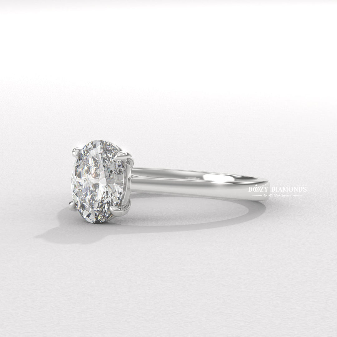 Angled view of oval cut diamond in solitaire setting