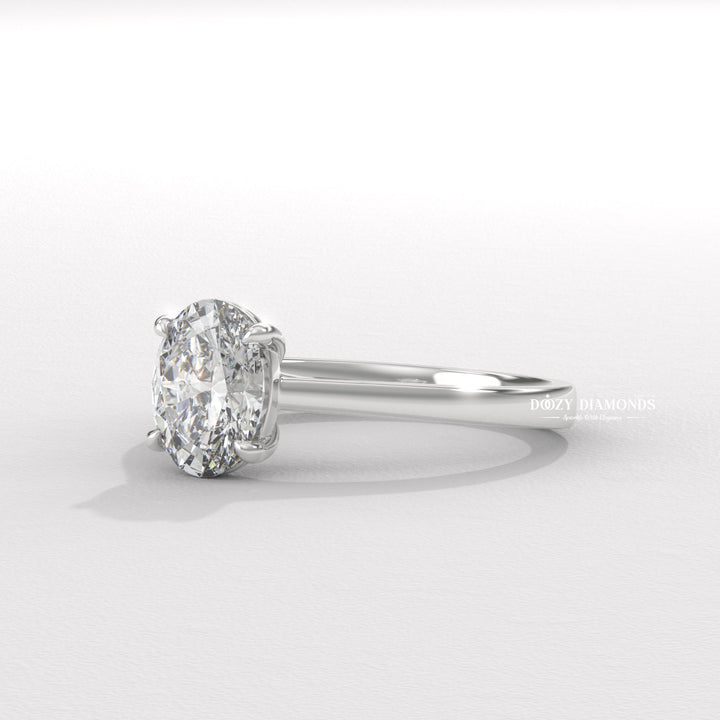 Angled view of oval cut diamond in solitaire setting