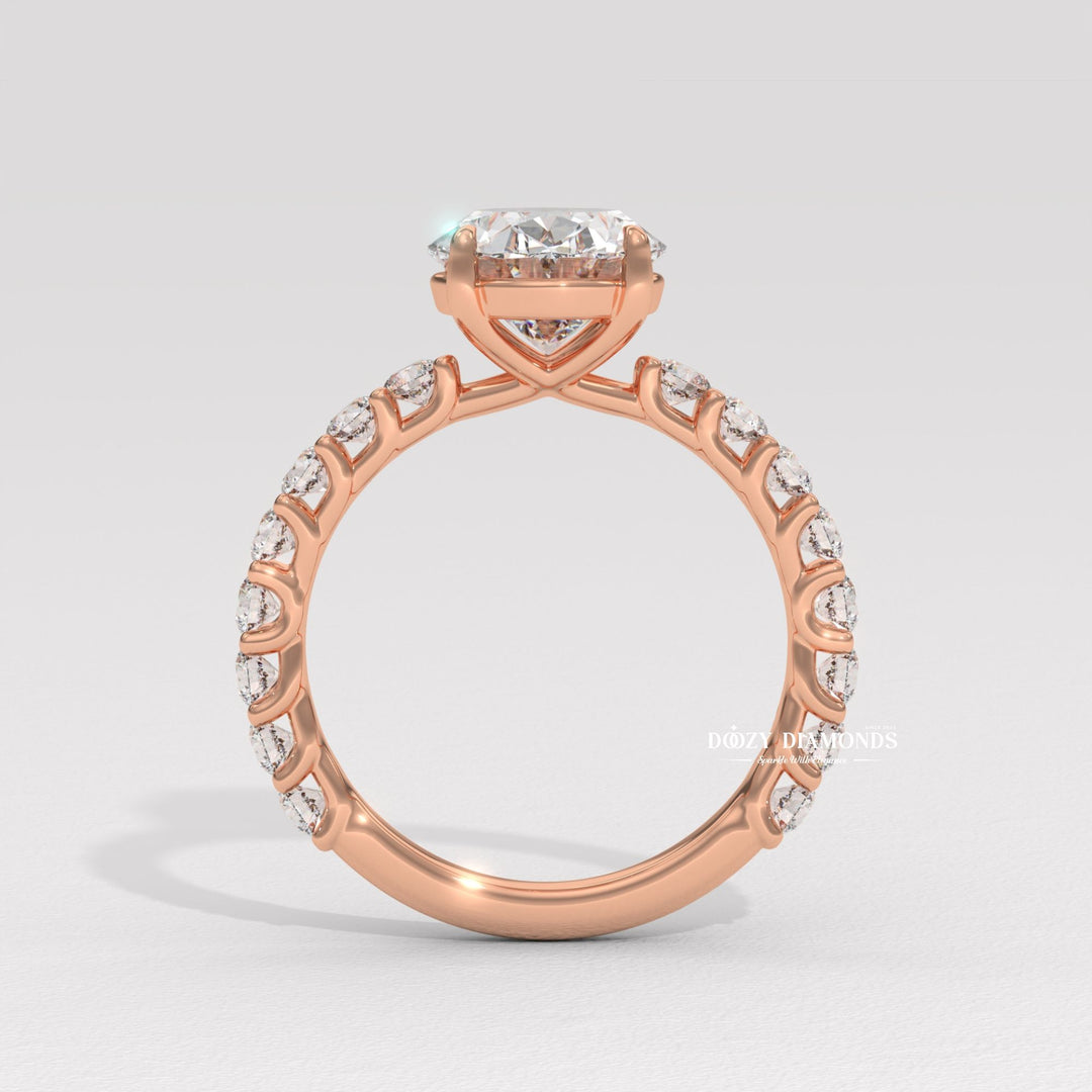 Profile view of oval cut pave engagement ring band