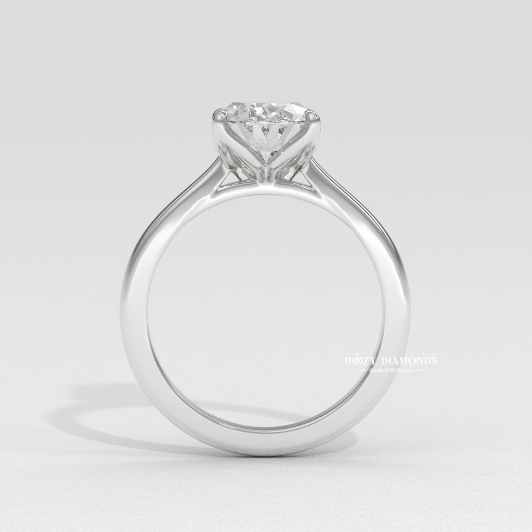 Oval solitaire diamond ring displayed on jewelry stand