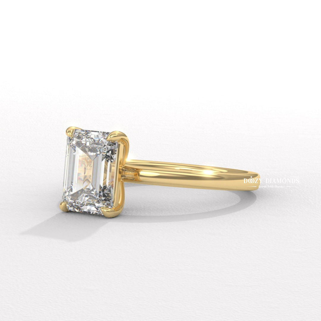 Emerald solitaire engagement ring finished in polished solid gold