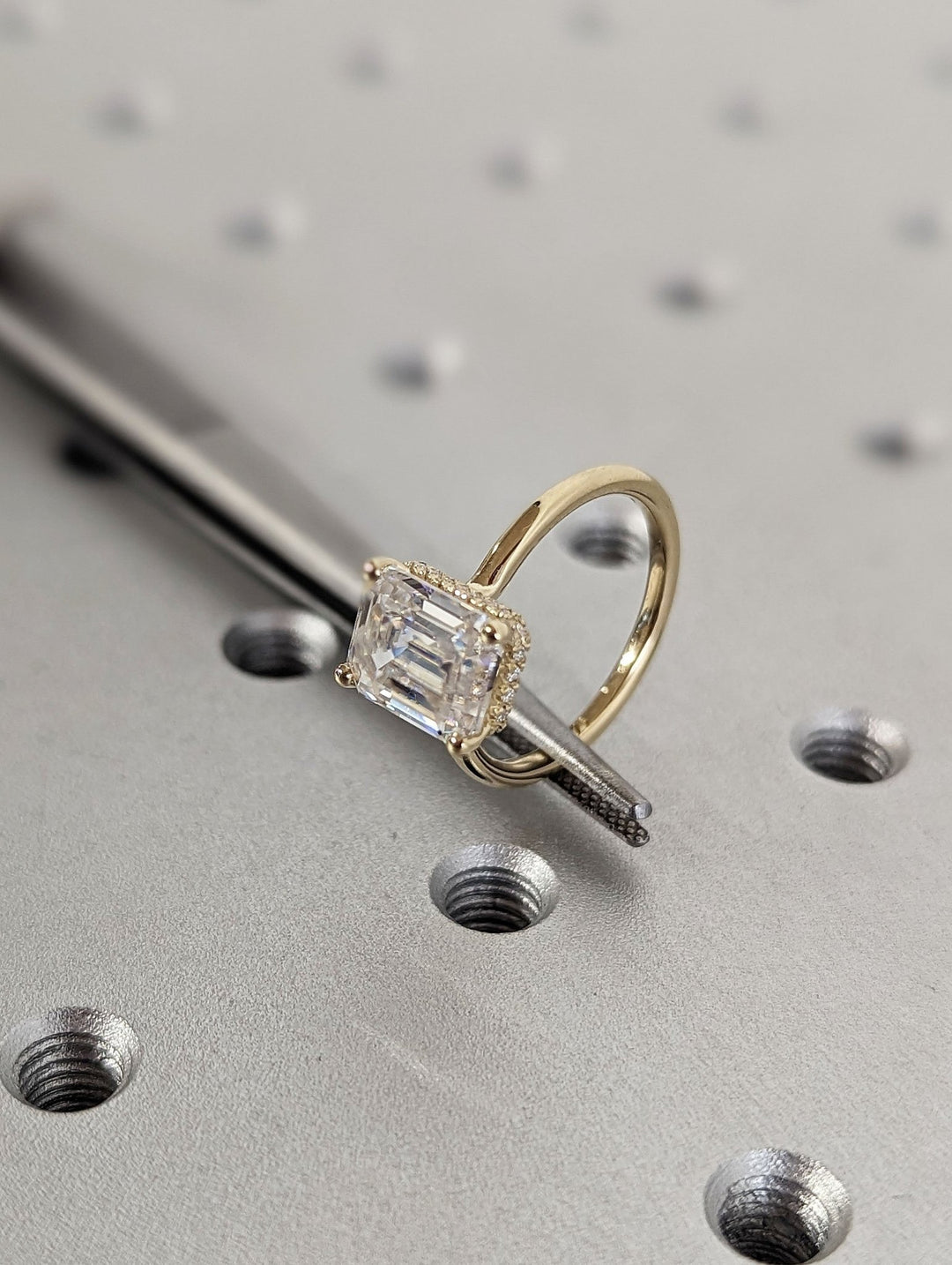 Emerald hidden halo lab grown diamond ring side profile in gold setting