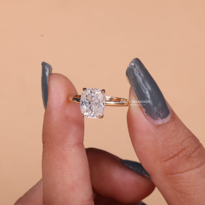 Cushion cut diamond ring worn on hand