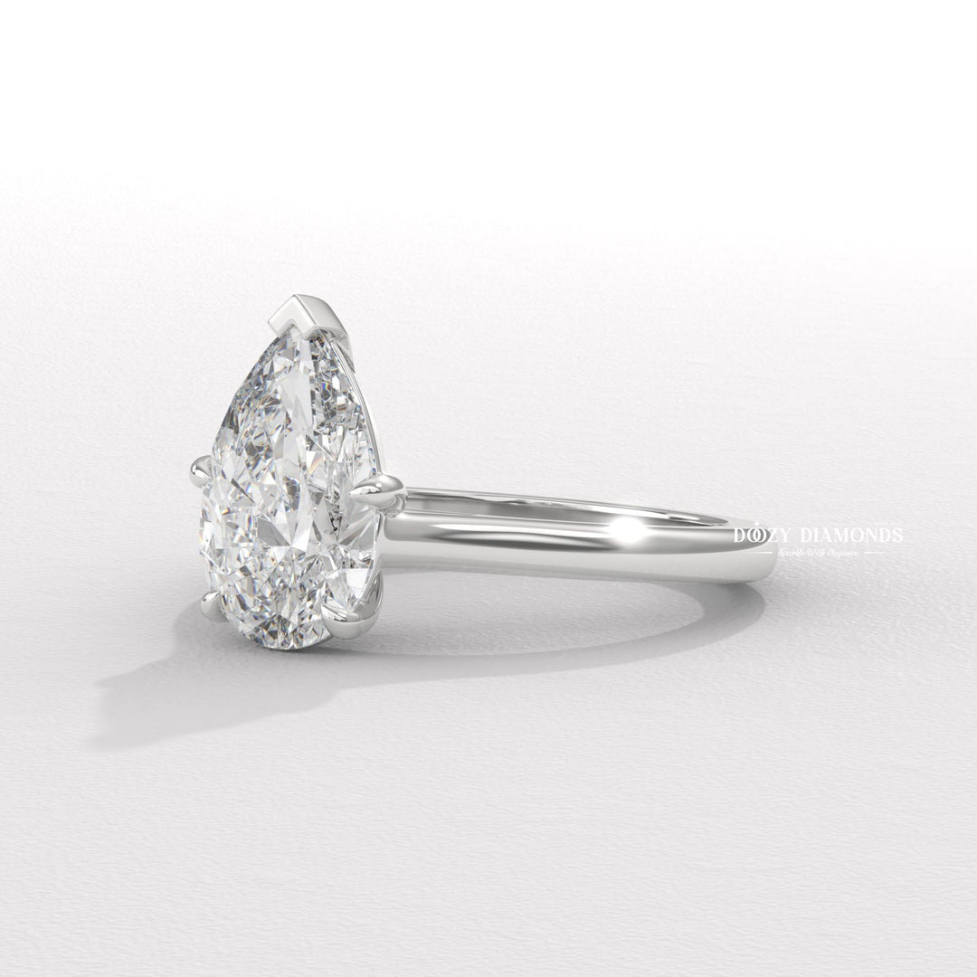 Detailed close-up of pear solitaire diamond engagement ring