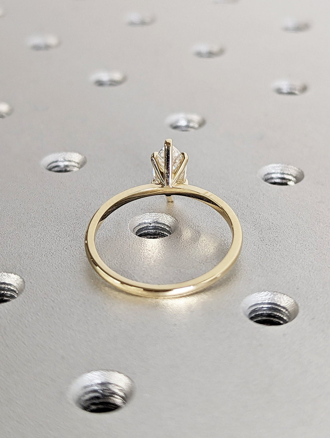 Profile view of marquise cut solitaire engagement ring band