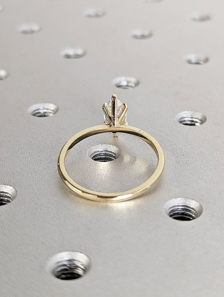 Profile view of marquise cut solitaire engagement ring band