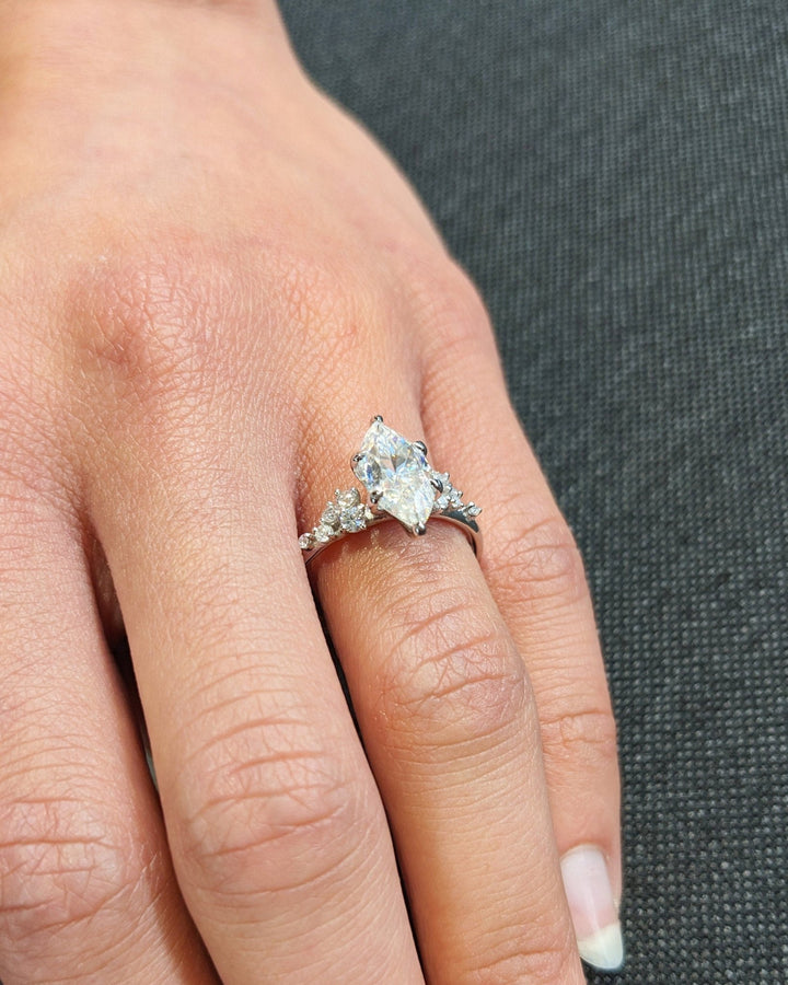 Marquise cut cluster engagement ring shown in real-life wear