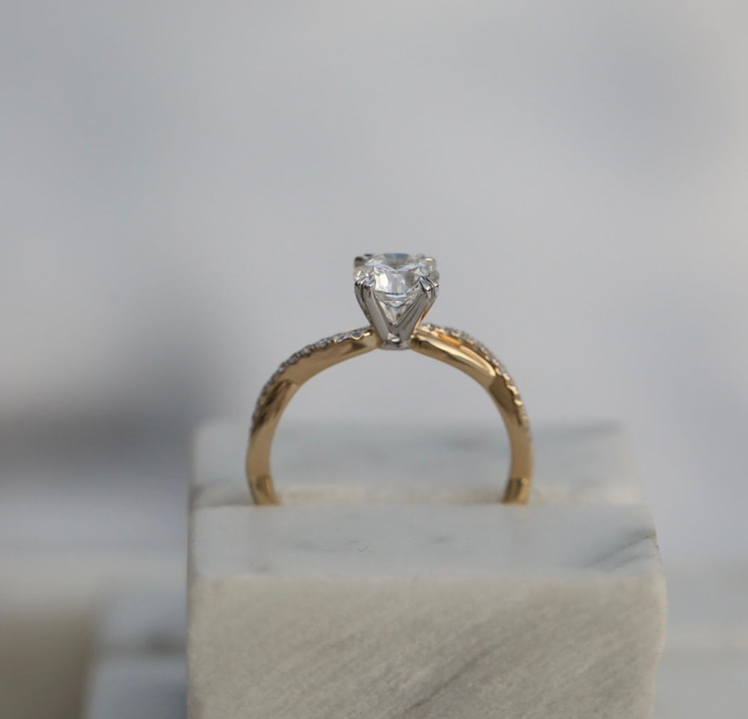 Side angle of round solitaire diamond engagement ring