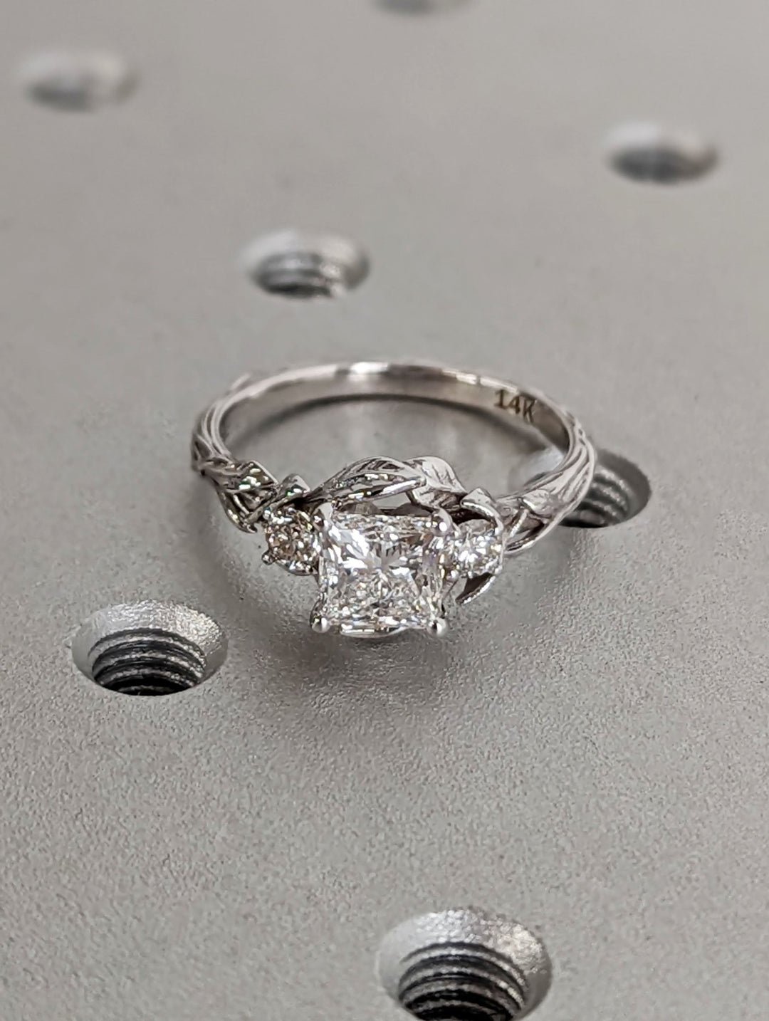 Unboxing view of princess cut vintage diamond engagement ring