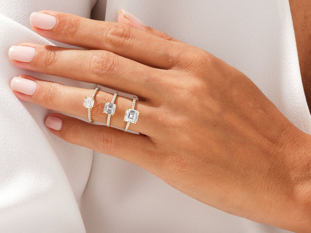 Unboxing view of asscher cut pave diamond engagement ring