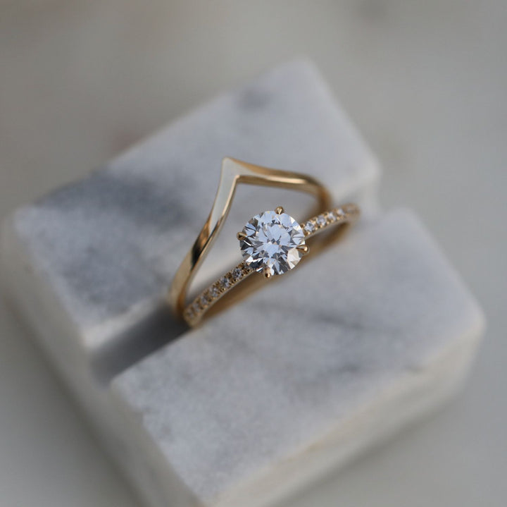 Macro shot of round cut diamond facets in solitaire ring setting