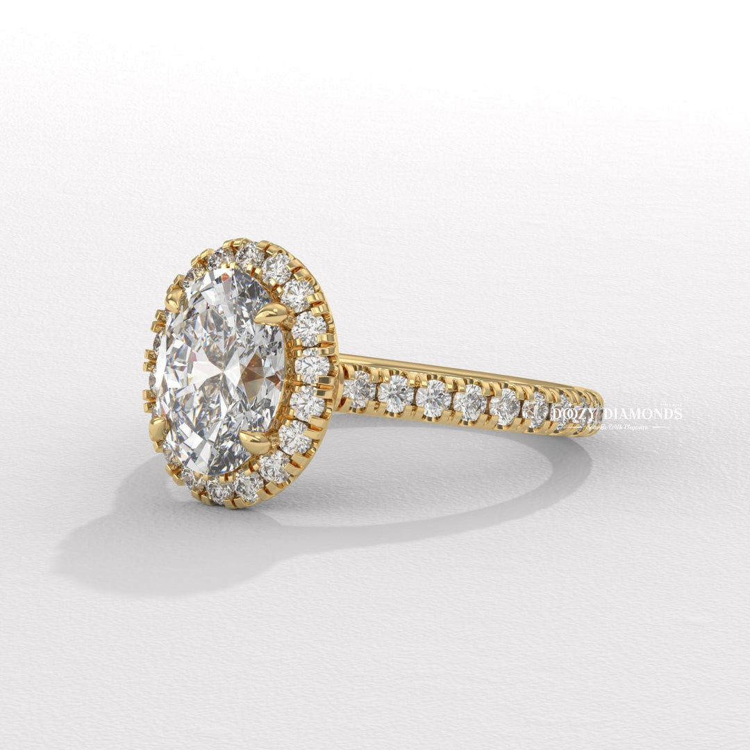 Oval halo engagement ring shown on hand for true-to-life sizing