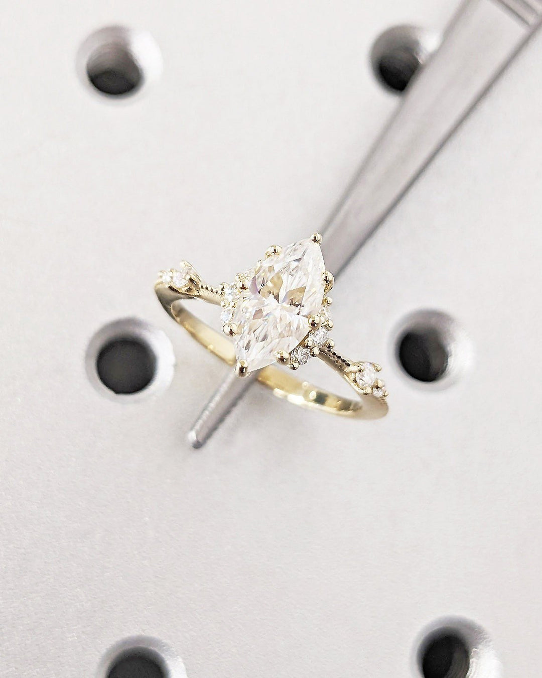 Marquise cluster engagement ring close-up highlighting diamond sparkle