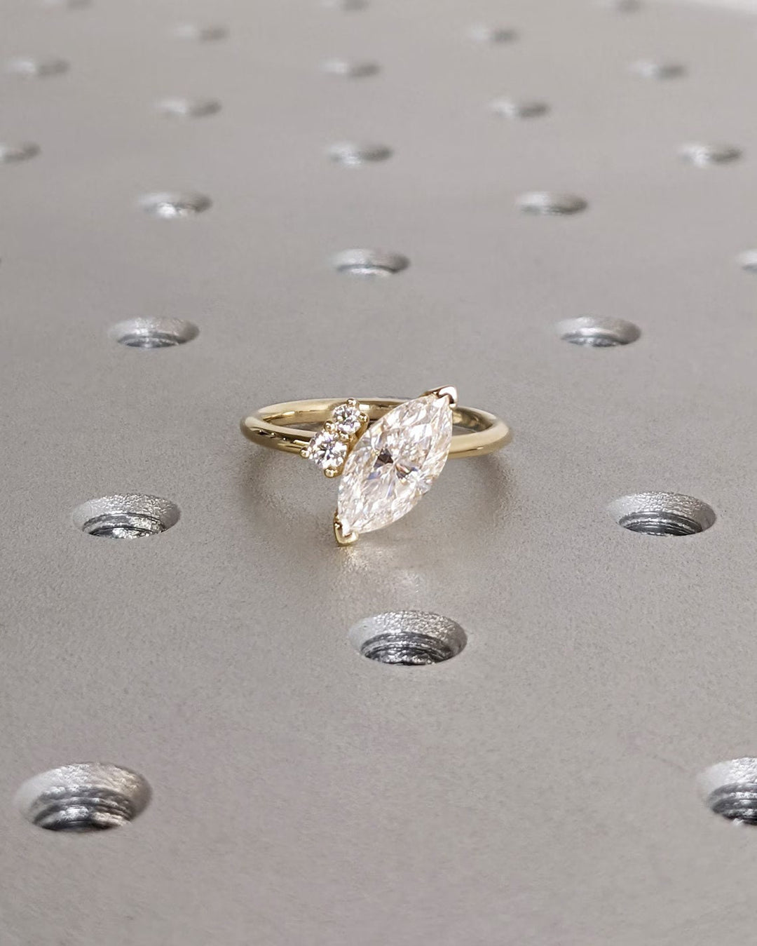 Marquise cluster ring set with an IGI graded diamond