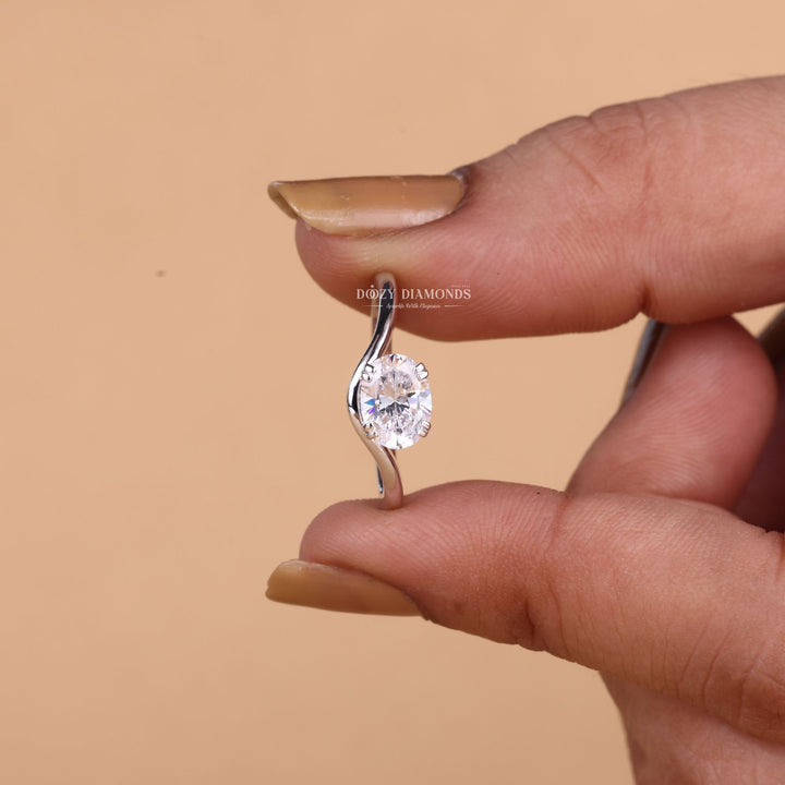Oval cut solitaire engagement ring shown in real-life wear