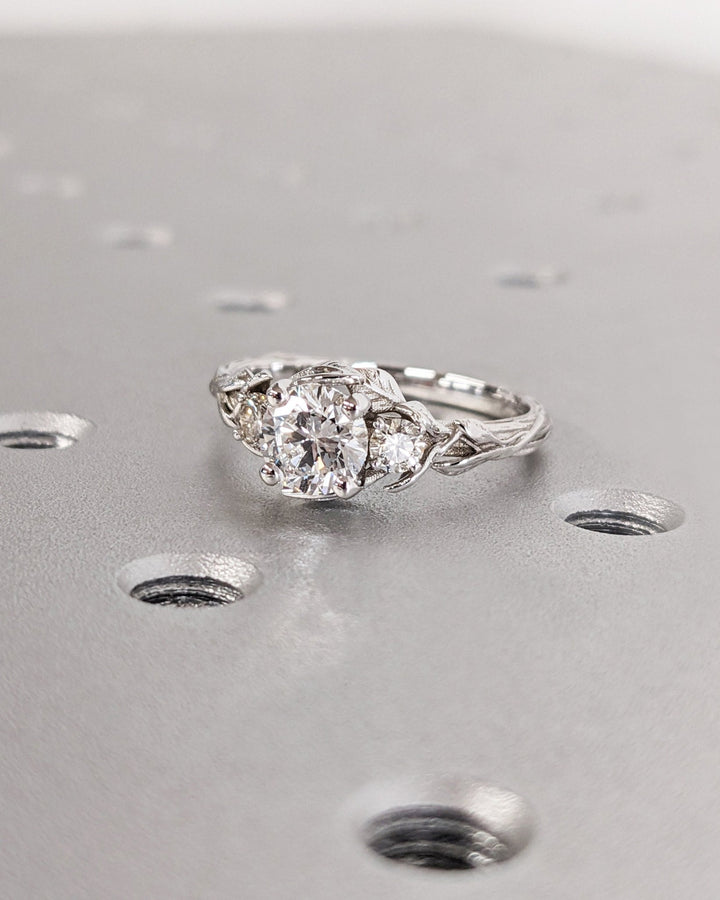 Shop the round cut three stone engagement ring collection online