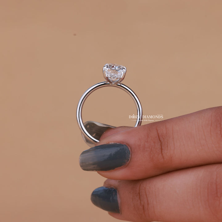 Lifestyle shot of cushion hidden halo diamond ring on hand