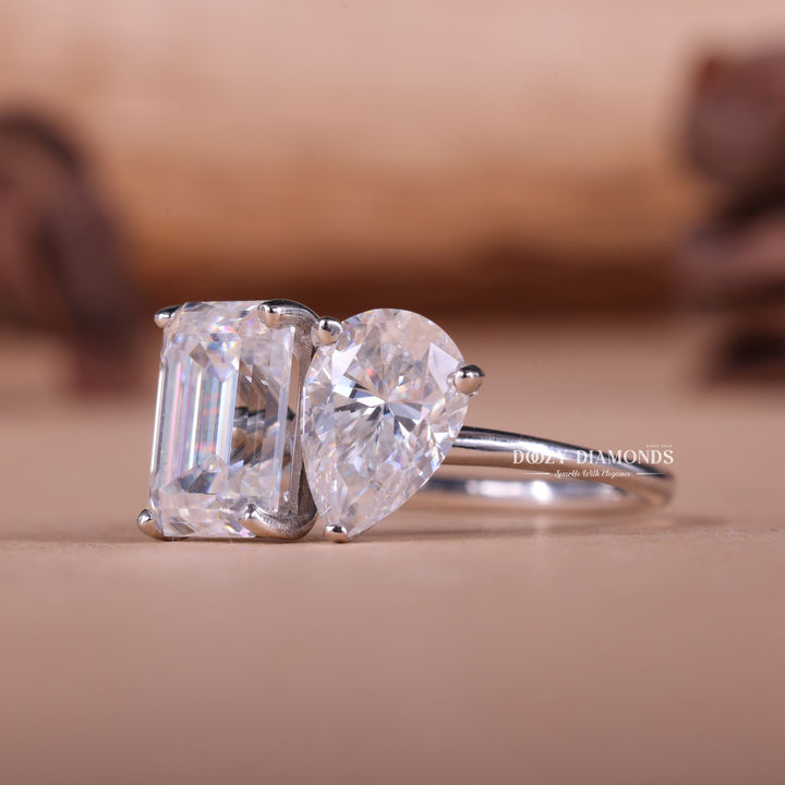 Pear solitaire engagement ring close-up showing E/VS1 diamond clarity